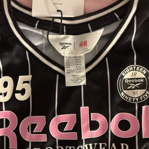 Reebok x HM  collection Jersey and Black Pleated Skirt